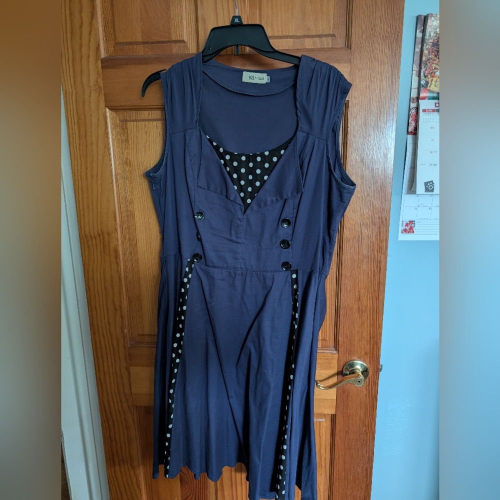 Elegant Navy Sleeveless Dress with Polka Dot Detail